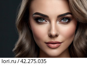 Close up portrait wink eye woman, posing at dark gray background, looking at camera. Emotional face of lovely young flirting lady isolated on blank studio wall. Human emotions concept. Copy text space. Стоковое AI-изображение, AI-художник Aleksandr Golubev / Фотобанк Лори