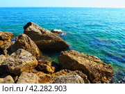 Flysch is a series of marine sedimentary rocks that are predominantly clastic in origin and are characterized by alternation of lithological layers. Balkans, Montenegro, Budva, Mogren beach. The sea. Стоковое фото, фотограф Юлия Петровская / Фотобанк Лори