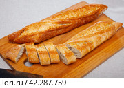 French loaves with chopped slices. Стоковое фото, фотограф Яков Филимонов / Фотобанк Лори