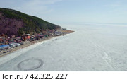 Lake Baikal in early spring. Listvyanka village, a popular place for traveling . Стоковое видео, видеограф Виктория Тельминова / Фотобанк Лори