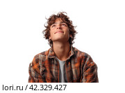 Portrait of a handsome young man with curly hair looks up dreamily isolated on white background. Стоковое AI-изображение, AI-художник Евгений Харитонов / Фотобанк Лори