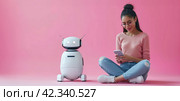 Female and robot on pink backround. Concept of future, innovations, modern technologies, Chatbots, communication. Стоковое AI-изображение, AI-художник Alexander Tihonovs / Фотобанк Лори