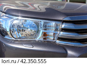 Headlight of an expensive off-road car close-up. Стоковое фото, фотограф Евгений Ткачёв / Фотобанк Лори