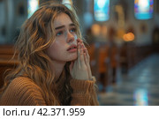 Young woman in tears and prayers at confession in empty church. Стоковое AI-изображение, AI-художник Юрий Поздников / Фотобанк Лори