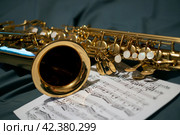 Saxophone and notes. Стоковое фото, фотограф Евгения Кравцова / Фотобанк Лори