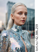 Futuristic female silver suit. People of the future. Image generated by AI. Стоковое AI-изображение, AI-художник Андрей Аркуша / Фотобанк Лори