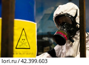 People in protective suits in the laboratory for the production of chemical and biological weapons. Стоковое фото, фотограф Андрей Шалари / Фотобанк Лори