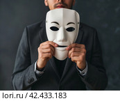Man Concealing Identity with White Mask. Стоковое AI-изображение, AI-художник Кирилл Черезов / Фотобанк Лори