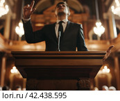 Public Speaker at Lectern in Elegant Hall. Стоковое AI-изображение, AI-художник Кирилл Черезов / Фотобанк Лори
