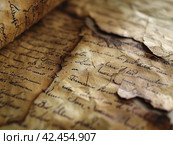 Old parchment paper with illegible writing on it,    Generative AI. Стоковое AI-изображение, AI-художник Анна Кривицкая / Фотобанк Лори