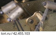 Internal clock mechanism. Impact watch hammers driven by clockwork. Macro shot. Стоковое видео, видеограф EStarodubov / Фотобанк Лори