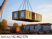 Prefabricated home lifted steel. Generate Ai. Стоковое AI-изображение, AI-художник Иван Рябоконь / Фотобанк Лори