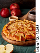 Apple pie, galette with fruits, sweet pastries on dark green tablecloth, vertical. Стоковое фото, фотограф Natalia Gdovskaia / Фотобанк Лори
