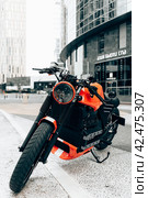 BMW K 100 RT custom motorcycle parked on a street. BMW K100 motorbike on background of modern city (2022 год). Редакционное фото, фотограф Константин Григорьев / Фотобанк Лори