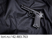 handgun on black background. Стоковое фото, фотограф Сергей Толмачёв / Фотобанк Лори