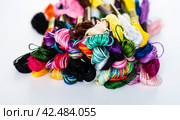 Many skeins of mouline thread for embroidery on a row in circle on black background. Стоковое фото, фотограф Татьяна Терехина / Фотобанк Лори
