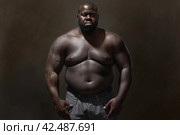Fat black man. Generate ai. Стоковое AI-изображение, AI-художник Иван Рябоконь / Фотобанк Лори