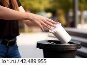 Woman throwing paper coffee cup. Generate ai. Стоковое AI-изображение, AI-художник Иван Рябоконь / Фотобанк Лори