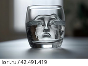 Pareidolia phenomenon in glass of water. Generate ai. Стоковое AI-изображение, AI-художник Иван Рябоконь / Фотобанк Лори