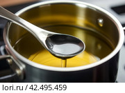 Saucepan and ladle with used cooking oil. Generate Ai. Стоковое AI-изображение, AI-художник Иван Рябоконь / Фотобанк Лори