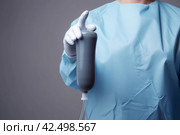 Doctor holding rubber enema rectal. Generate Ai. Стоковое AI-изображение, AI-художник Иван Рябоконь / Фотобанк Лори