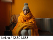Warming up house economic heating solutions with blanket. Generate Ai. Стоковое AI-изображение, AI-художник Иван Рябоконь / Фотобанк Лори