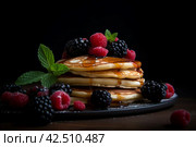 Pancakes berries breakfast plate. Generate ai. Стоковое AI-изображение, AI-художник Иван Рябоконь / Фотобанк Лори