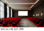 Conference room with red chairs, interior lighting, and empty white insulated screen. Business meetings, conferences, trainings, used as template for elegant design. Interior of the conference hall. Стоковое AI-изображение, AI-художник Aleksandr Golubev / Фотобанк Лори