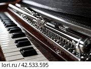 Flute with piano. Flute on piano keys. Wind instrument for musical design of concert creativity. Стоковое AI-изображение, AI-художник Aleksandr Golubev / Фотобанк Лори