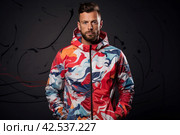 Stylish Man wear colorful windbreaker futuristic. Generate Ai. Стоковое AI-изображение, AI-художник Иван Рябоконь / Фотобанк Лори