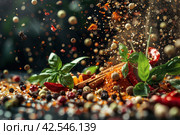Vibrant assortment of aromatic spices and herbs suspended in the air. Стоковое AI-изображение, AI-художник Юрий Поздников / Фотобанк Лори