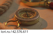 Golden Hour Exploration: Vintage Compass on Antique Map by Seaside. Стоковое видео, видеограф Сергей Толмачёв / Фотобанк Лори