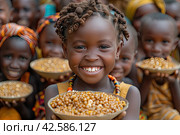 The problem of poverty and inequality. Happy african kids eating some sorghum porridge in village outdoor. Стоковое AI-изображение, AI-художник Ирина Михайличенко / Фотобанк Лори