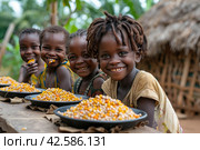 The problem of poverty and inequality. Happy african kids eating some sorghum porridge in village outdoor. Стоковое AI-изображение, AI-художник Ирина Михайличенко / Фотобанк Лори