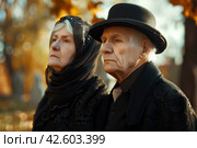 Осень. Пожилая пара на кладбище. Стоковое AI-изображение, AI-художник Щеголева Ольга / Фотобанк Лори