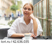 Portrait of female who is enjoying coffee in cafe. Стоковое фото, фотограф Яков Филимонов / Фотобанк Лори