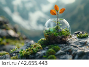 A glass terrarium in the shape of a sphere, inside of which there is a miniature ecosystem: moss, stones and a small tree with bright orange leaves.,    Generative AI. Стоковое AI-изображение, AI-художник Анна Кривицкая / Фотобанк Лори