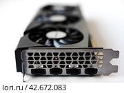 A black and white video card on a white background. Fans and the graphics card case. Computer accessories. Стоковое фото, фотограф Valeriy Lushchikov / Фотобанк Лори