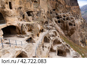 Vardzia ancient cave city carved into the rock - famous attraction of Georgia. Стоковое фото, фотограф Яков Филимонов / Фотобанк Лори