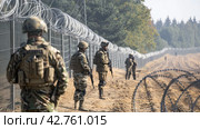 A military outfit guards the border of the forbidden zone. Стоковое AI-изображение, AI-художник Ярославский Максим / Фотобанк Лори