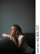 Depressed mid-aged woman at home feeling sad, lonely, anxious. Стоковое фото, фотограф Viktor Cap / PantherMedia / Фотобанк Лори