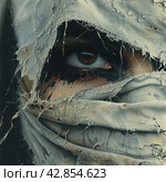 The eye of a man looking through torn fabric. It is especially expressive due to contrasting colors and realistic details, such as the reflection of light in the eye and thin blood vessels. Стоковое AI-изображение, AI-художник Анна Кривицкая / Фотобанк Лори