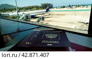 Passport lies on a chair at the airport. Стоковое фото, фотограф Igor Skripachev / Фотобанк Лори