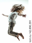 Joyful Child Jumping in Air. Стоковое AI-изображение, AI-художник Кирилл Черезов / Фотобанк Лори