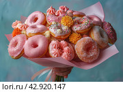 Букет пончиков в руках на голубом фоне. Bouquet of donuts in hand on blue background. Стоковое AI-изображение, AI-художник Katsiaryna Repich / Фотобанк Лори