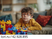 A child with autism spectrum disorders (ASD) such as Asperger's, Rhett and Heller. Стоковое AI-изображение, AI-художник Ирина Ручушкина / Фотобанк Лори