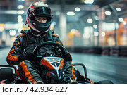 male racer in a helmet driving a go-kart on an indoor track close-up. Стоковое AI-изображение, AI-художник Александр Довянский / Фотобанк Лори