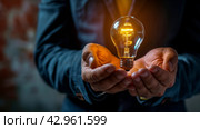 Man Holding Light Bulb. Стоковое AI-изображение, AI-художник Юлия Гапеенко / Фотобанк Лори