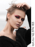 Portrait of blonde woman is epitome of sensuality. She is wearing short hairdo and bright makeup. Стоковое фото, фотограф А. А. Пирагис / Фотобанк Лори