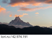 View of Mount Machapuchare (from Nepali meaning 'fishtail') from Poon Hill (3210 m) on sunrise, Annapurna Conservation Area, Himalaya, Nepal (2018 год). Стоковое фото, фотограф VittoriaChe / Фотобанк Лори